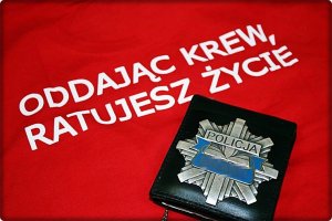 Obraz przedstawia napis- oddajesz krew ratujesz życie W tle legitymacja służbowa policjanta