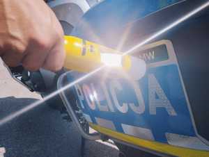 obraz przedstawia napis policja