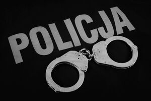 obraz przedstawia kajdanki oraz napis Policja